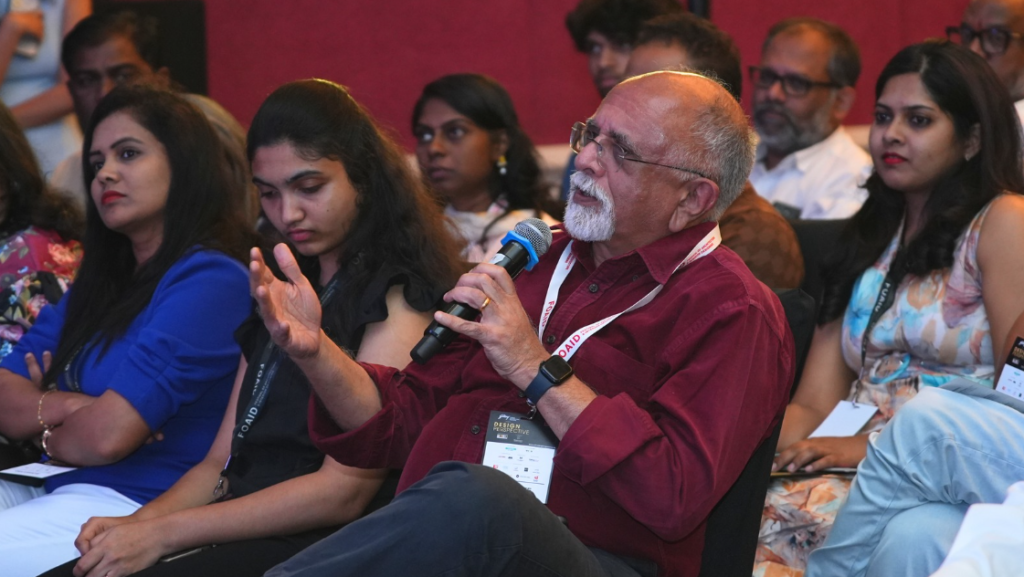 The diverse audience, including seasoned architects, designers, and emerging voices, captured in a moment of shared focus and engagement, embodying the spirit of collaboration
